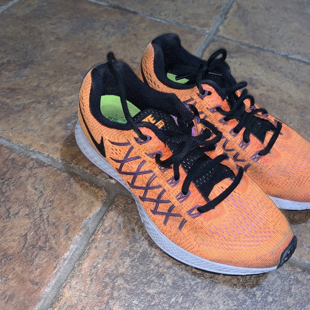 Orange Nike running shoes